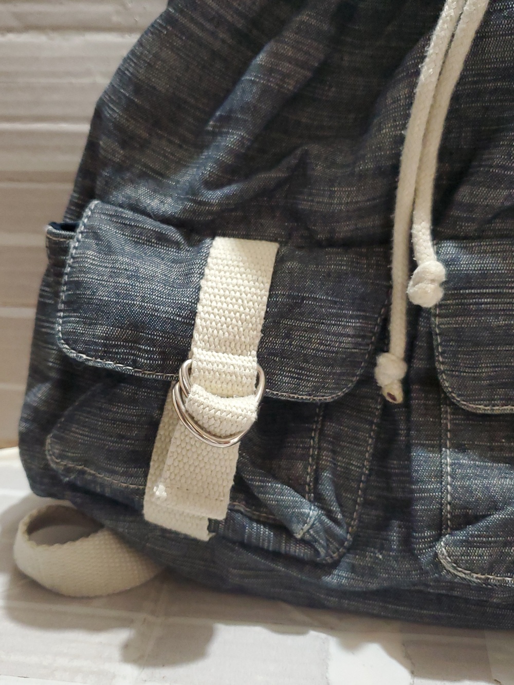 Denim-Look Drawstring Backpack with Cream Strap Details - Picture 4 of 12